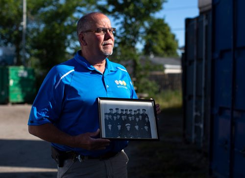 ANDREW RYAN / WINNIPEG FREE PRESS  Bruce Henley, holds a photograph of his late father, Bob Henley, during his time as a firefighter on July 18, 2018.