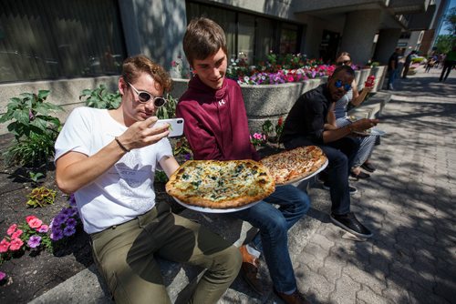 MIKE DEAL / WINNIPEG FREE PRESS
Jeremy Franczyk and Jared Kasdorf take a photo of their pizza it looks so good after finding a spot to eat along Broadway during the lunch hour. 
180713 - Friday, July 13, 2018.
24hourproject