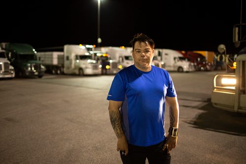 ANDREW RYAN / WINNIPEG FREE PRESS  Cory Bodnarchuk, said one of the most difficult parts of driving trucks is eating healthy, something he's very conscious of on the job. Bodnarchuk poses for a picture in front of his truck at the Flying J in Headingley on July 13, 2018. 24hourproject