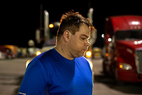 ANDREW RYAN / WINNIPEG FREE PRESS  Cory Bodnarchuk, said one of the most difficult parts of driving trucks is eating healthy, something he's very conscious of on the job. Bodnarchuk poses for a picture in front of his truck at the Flying J in Headingley on July 13, 2018. 24hourproject