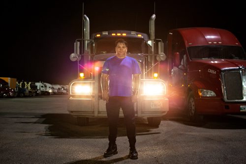 ANDREW RYAN / WINNIPEG FREE PRESS  Cory Bodnarchuk, said one of the most difficult parts of driving trucks is eating healthy, something he's very conscious of on the job. Bodnarchuk poses for a picture in front of his truck at the Flying J in Headingley on July 13, 2018. 24hourproject