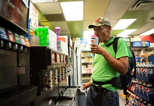 ANDREW RYAN / WINNIPEG FREE PRESS  Rob Meekis takes the first taste of his slurpee at Walia's Gas & Carwash around 4:00 a.m. on Friday July 13, 2018. 24hourproject