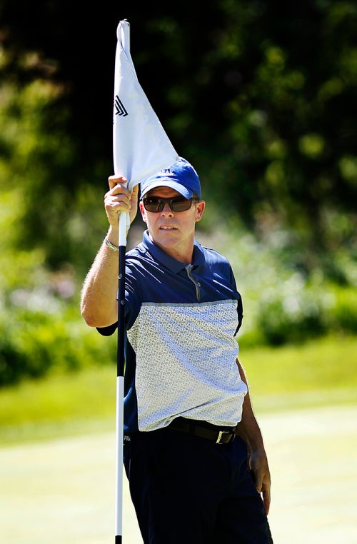 PHIL HOSSACK / WINNIPEG FREE PRESS - Todd Fanning manages the flag on the 15th Wednesday afternoon at Glendale Golf Club in the Manitoba Men's Amature tournament. Mike Sawatzky's story.  - July 17, 2018