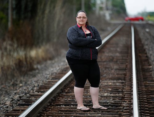 PHIL HOSSACK / WINNIPEG FREE PRESS - Kari Olson poses on the CNR main line near Shaftsbury where she maintains trains started fires this spring. See Ryan's story.  - July 17, 2018