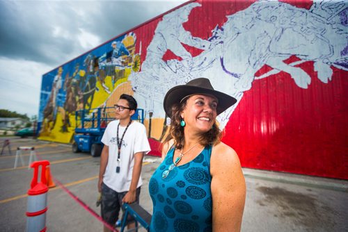 MIKAELA MACKENZIE / WINNIPEG FREE PRESS
Sarah Collard, lead artist, and Mason McIvor, youth artist, pose in front of the Manitoba Stampede mural they are painting in Morris on Thursday, July 19, 2018. 
Mikaela MacKenzie / Winnipeg Free Press 2018.