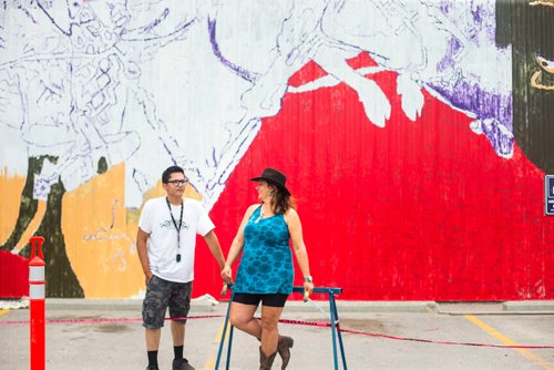 MIKAELA MACKENZIE / WINNIPEG FREE PRESS
Sarah Collard, lead artist, and Mason McIvor, youth artist, pose in front of the Manitoba Stampede mural they are painting in Morris on Thursday, July 19, 2018. 
Mikaela MacKenzie / Winnipeg Free Press 2018.