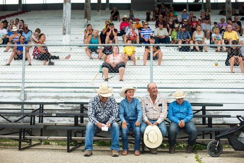 MIKAELA MACKENZIE / WINNIPEG FREE PRESS
Dennis Langevin (left), Gibson McNarland, Gordie McNarland, and Luke Neufeld watch the clown act at the Manitoba Stampede in Morris on Thursday, July 19, 2018. 
Mikaela MacKenzie / Winnipeg Free Press 2018.