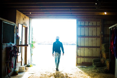 MIKAELA MACKENZIE / WINNIPEG FREE PRESS
Jockey Antonio Whitehall walks out of the barns at the Assiniboia Downs in Winnipeg on Thursday, July 19, 2018. 
Mikaela MacKenzie / Winnipeg Free Press 2018.