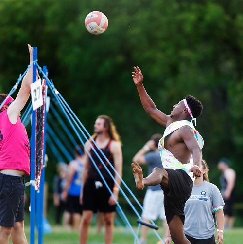 PHIL HOSSACK / WINNIPEG FREE PRESS - SUPERSPIKE - Participants in the annual beach volleyball tournament scramble to recover Friday night at Maple Grove Park. See story.  - July 20, 2018
