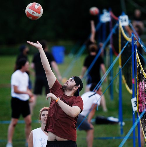 PHIL HOSSACK / WINNIPEG FREE PRESS - SUPERSPIKE - Participants in the annual beach volleyball tournament enjoy the game Friday night at Maple Grove Park. See story.  - July 20, 2018
