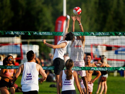 PHIL HOSSACK / WINNIPEG FREE PRESS - SUPERSPIKE - Participants in the annual beach volleyball tournament go high Friday night at Maple Grove Park. See story.  - July 20, 2018