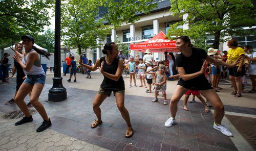 MIKE DEAL / WINNIPEG FREE PRESS
Dancers with the Body Orchestra Collective teach kids some dance moves in the Kids Fringe area beside Old Market Square Saturday afternoon.
180721 - Saturday, July 21, 2018.
