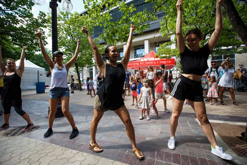 MIKE DEAL / WINNIPEG FREE PRESS
Dancers with the Body Orchestra Collective teach kids some dance moves in the Kids Fringe area beside Old Market Square Saturday afternoon.
180721 - Saturday, July 21, 2018.