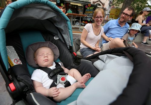 TREVOR HAGAN / WINNIPEG FREE PRESS
Nicole and Derek Frykas, with their kids, Ethan, 7 weeks, and Isaac, 2, at the Fringe Festival in Old Market Square, Sunday, July 22, 2018.