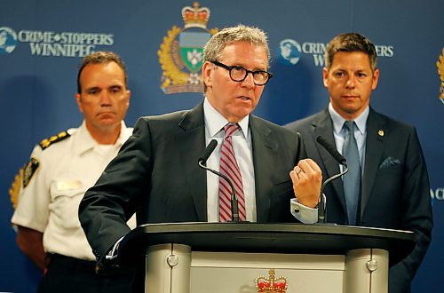 PHIL HOSSACK / WINNIPEG FREE PRESS - Police Board Chair David Asper is flanked by Police Chief Danny Smyth (left) and Mayor Brian Bowman at the Monday morning press briefing. See story.   - July 23, 2018