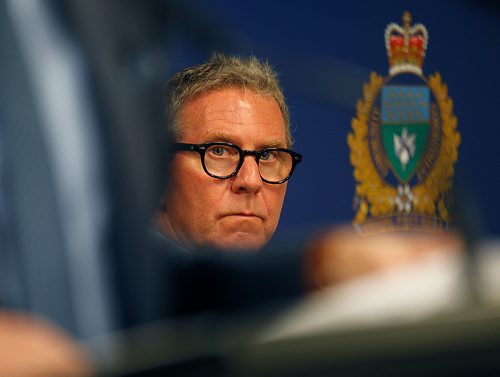 PHIL HOSSACK / WINNIPEG FREE PRESS - Police Board Chair David Asper watches Mayor BRIAN BOWMAN speak at the Monday morning police press briefing. See story.   - July 23, 2018