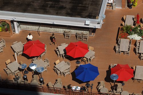 MIKE DEAL / WINNIPEG FREE PRESS
Views of the Tavern United patio from the 17th floor offices of Thompson Dorfman Sweatman (TDS) at True North Square Monday morning.
180723 - Monday, July 23, 2018.