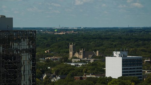 MIKE DEAL / WINNIPEG FREE PRESS
Views of the Westminster United Church and South West Winnipeg from the 17th floor offices of Thompson Dorfman Sweatman (TDS) at True North Square Monday morning.
180723 - Monday, July 23, 2018.