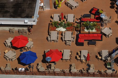 MIKE DEAL / WINNIPEG FREE PRESS
Views of the Tavern United patio from the 17th floor offices of Thompson Dorfman Sweatman (TDS) at True North Square Monday morning.
180723 - Monday, July 23, 2018.