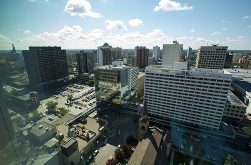 MIKE DEAL / WINNIPEG FREE PRESS
Views of Winnipeg from the 17th floor offices of Thompson Dorfman Sweatman (TDS) at True North Square Monday morning.
180723 - Monday, July 23, 2018.