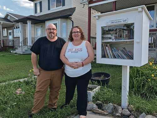 Canstar Community News Richard and Deborah Mantik set up their Little Free Library at 109 Redonda St. in June 2017. They said there library gets a lot of foot traffic and is well used. (SHELDON BIRNIE/CANSTAR/THE HERALD)