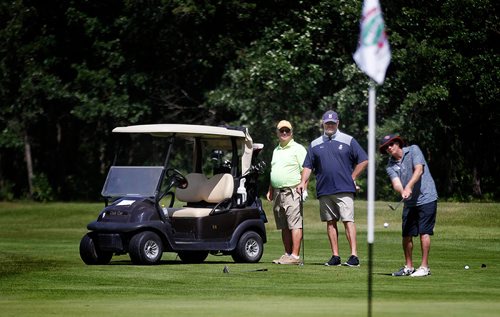 PHIL HOSSACK / WINNIPEG FREE PRESS - left to right; Tony Fletcher, Rick Forney and Andrew Collier enjoy an afternoon on Breezy Bend's back nine Monday. STANDUP   - July 23, 2018