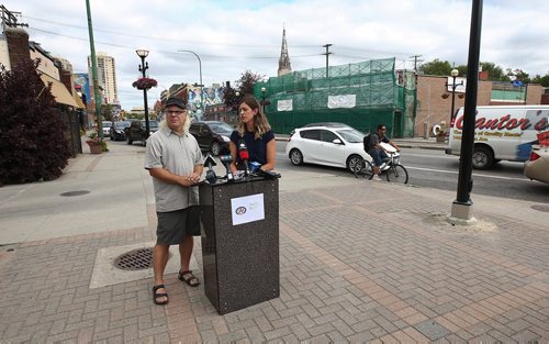 MIKE DEAL / WINNIPEG FREE PRESS
Liz Kulyk with CAA Manitoba and Mark Cohoe with Bike Winnipeg talk to the media at the corner of Osborne and Stradbrook during an effort to raise awareness and help frame the discussion about infrastructure and cycling ahead of the civic election.
180724 - Tuesday, July 24, 2018.