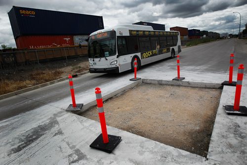 PHIL HOSSACK / WINNIPEG FREE PRESS - Southbound lanes of the rapid transit between Queen Elizabeth Way and Harkness station (the first station at Stradbrook and Harkness) are closed for maintenance of the roadway. Just a few metres south of the normal station a temporary southbound stop has been set up. See story. - July 24, 2018