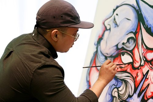 SUPPLIED PHOTO

Artist Jay Cabredo puts the finishing touches on his piece before the art auction take part in NorWest Co-op Community Food Centre's fourth annual Art of Good Food fundraiser on May 16, 2018 at The Manitoba Museum. (See Social Page)