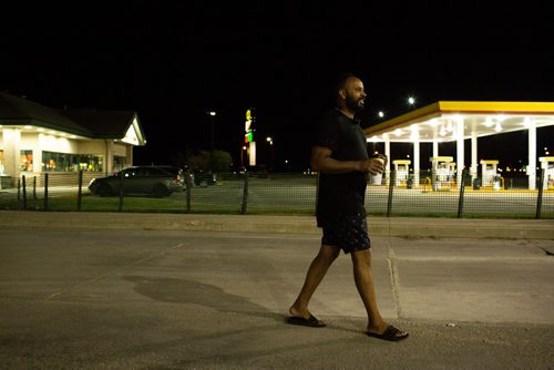 ANDREW RYAN / WINNIPEG FREE PRESS A truck driver, who didn't want to be named, walks back to his vehicle with a coffee from the Flying J in Headingly on July 13, 2018. 24hourproject
