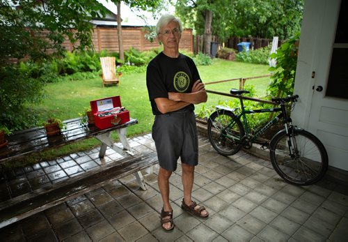 ANDREW RYAN / WINNIPEG FREE PRES Ken Schykulski, 60, is a volunteer bike mechanic at the WRENCH (Winnipeg Repair Education and Cycling Hub). Schykulski poses for a portrait in his backyard on July 24, 2018.