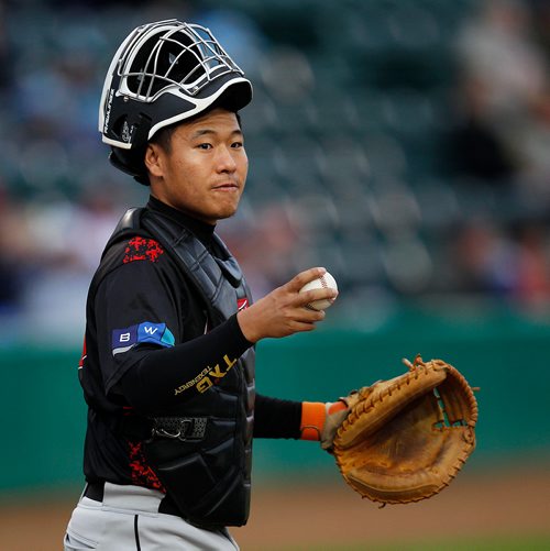 PHIL HOSSACK / WINNIPEG FREE PRESS - Beijing Shougang Eagles catcher #33 Luan Chenchen took care of business behonf the plate for a team combined with the Texas Airhogs Wednesday evening against the Goldeyes. - July 25, 2018
