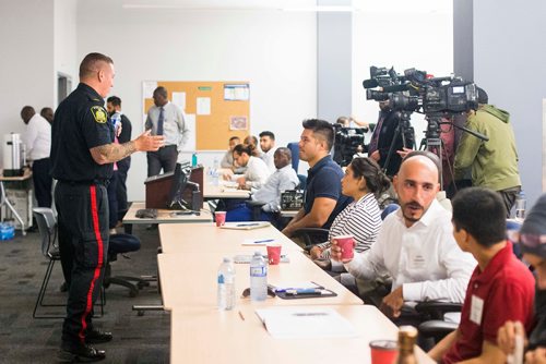 MIKAELA MACKENZIE / WINNIPEG FREE PRESS
Constable Shawn Smith speaks at the Winnipeg Police Service Diversity Career Exhibition, open to Indigenous and newcomer community members interested in a career in law enforcement, at the Winnipeg Police Headquarters in Winnipeg on Thursday, July 26, 2018. 
Winnipeg Free Press 2018.