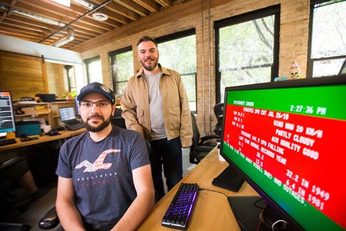 MIKAELA MACKENZIE / WINNIPEG FREE PRESS
Brandon Martel (left) and Craig Midwinter, who have resurrected the old-school Environment Canada weather channel, pose in their office in Winnipeg on Thursday, July 26, 2018. 
Winnipeg Free Press 2018.