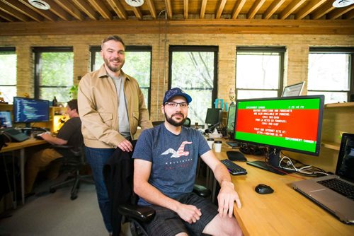 MIKAELA MACKENZIE / WINNIPEG FREE PRESS
Craig Midwinter (left) and Brandon Martel, who have resurrected the old-school Environment Canada weather channel, pose in their office in Winnipeg on Thursday, July 26, 2018. 
Winnipeg Free Press 2018.