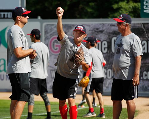 PHIL HOSSACK / WINNIPEG FREE PRESS - AirHog/Chinese National Team pitcher Liu Yu works on his form wuth coaches Kevin Joseph (left) and Larry Hardy (right) Thursday afternoon at Shaw Park as the mixed Chinese/American team worked out. See Taylor Allen story. - July 26, 2018