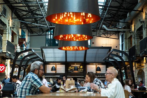 ANDREW RYAN / WINNIPEG FREE PRES The Commons wine and beer bar seen through patrons' tables at The Forks on July 26, 2018.