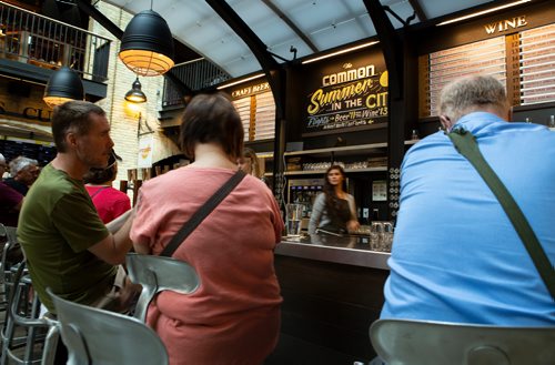 ANDREW RYAN / WINNIPEG FREE PRES The Commons wine and beer bar seen through bar patrons at The Forks on July 26, 2018.