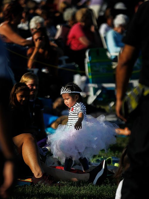 PHIL HOSSACK / WINNIPEG FREE PRESS - Dressed for the occasion, 2&1/2 yr old Clara Suban makes her way through the large crowd at Assiniboine Park Thursday evening as she and her parents took in the annual RWB Ballet in the Park performances. - July 26, 2018