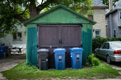 ANDREW RYAN / WINNIPEG FREE PRES Recycling bins sit in an alley way awaiting city pick-up. Reporter Jill Wilson looked through Wolseley residents' recycling bins for misplaced items on July 26, 2018.