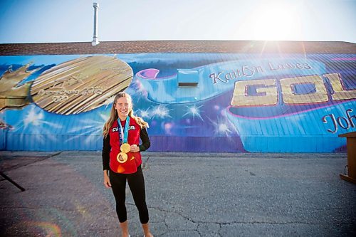 MIKAELA MACKENZIE / WINNIPEG FREE PRESS
Kaitlyn Lawes poses in front of St.Vital Curling Club's newest mural, commemorating her gold medal win in mixed doubles, in Winnipeg on Friday, July 27, 2018. 
Winnipeg Free Press 2018.