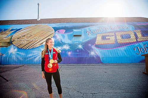 MIKAELA MACKENZIE / WINNIPEG FREE PRESS
Kaitlyn Lawes poses in front of St.Vital Curling Club's newest mural, commemorating her gold medal win in mixed doubles, in Winnipeg on Friday, July 27, 2018. 
Winnipeg Free Press 2018.