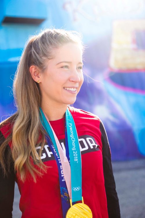 MIKAELA MACKENZIE / WINNIPEG FREE PRESS
Kaitlyn Lawes poses in front of St.Vital Curling Club's newest mural, commemorating her gold medal win in mixed doubles, in Winnipeg on Friday, July 27, 2018. 
Winnipeg Free Press 2018.