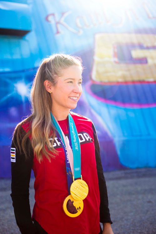 MIKAELA MACKENZIE / WINNIPEG FREE PRESS
Kaitlyn Lawes poses in front of St.Vital Curling Club's newest mural, commemorating her gold medal win in mixed doubles, in Winnipeg on Friday, July 27, 2018. 
Winnipeg Free Press 2018.