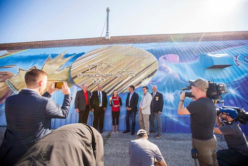 MIKAELA MACKENZIE / WINNIPEG FREE PRESS
Speakers Resby Coutts (left), Tom Ethans, Kaitlyn Lawes, Brian Bowman, Brian Mayes, and Ken Stevens take a group picture after the unveiling of the St.Vital Curling Club's newest mural in Winnipeg on Friday, July 27, 2018. 
Winnipeg Free Press 2018.