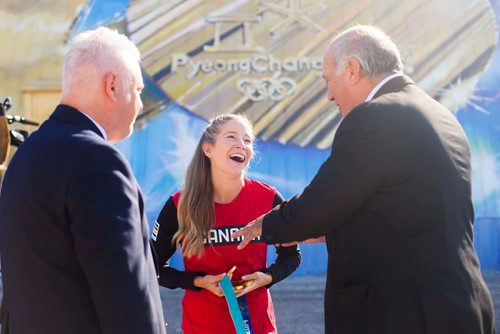 MIKAELA MACKENZIE / WINNIPEG FREE PRESS
Kaitlyn Lawes laughs with St. Vital Curling Club president Ken Stevens (left) and Take Pride Winnipeg executive director Tom Ethans with in front of St.Vital Curling Club's newest mural, commemorating her gold medal win in mixed doubles, in Winnipeg on Friday, July 27, 2018. 
Winnipeg Free Press 2018.