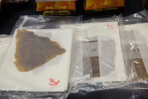 MIKE DEAL / WINNIPEG FREE PRESS
Sheets of shatter, a hard resin made from marihuana byproducts after bud processing, were part of the seizure.
Around 1000 lbs of marihuana and related materials were caught in a standard regulatory inspection stop by an RCMP officer on the Trans-Canada Highway in Westhawk, MB on July 22, 2018. According to the RCMP the seizure is the largest marihuana seizure through a traffic stop in Canada since 2015.
The drugs were put on display for the media at D Division Headquarters Friday morning.
180727 - Friday, July 27, 2018.