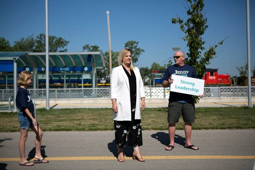 ANDREW RYAN / WINNIPEG FREE PRESS Jenny Motkaluk waits with her daughter and husband, Sprague Emily and Keith Poulson, an empty BRT terminal at Jubilee Southwest station before making a speech criticizing Winnipeg mayor Brian Bowman for investing millions into the infrastructure on July 27, 2018.