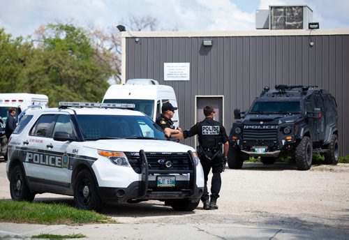 ANDREW RYAN / WINNIPEG FREE PRESS A heavy police presence is seen just outside of the Indian Metis Friendship Centre on July 27, 2018.