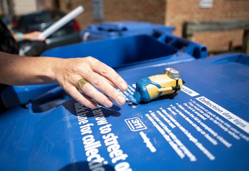 ANDREW RYAN / WINNIPEG FREE PRESS Reporter Jill Wilson removes a plastic toy from a Wolseley resident's recycling bin on July 26, 2018. Even though its made of plastic the toys cannot be placed in the city's recycling bins.
